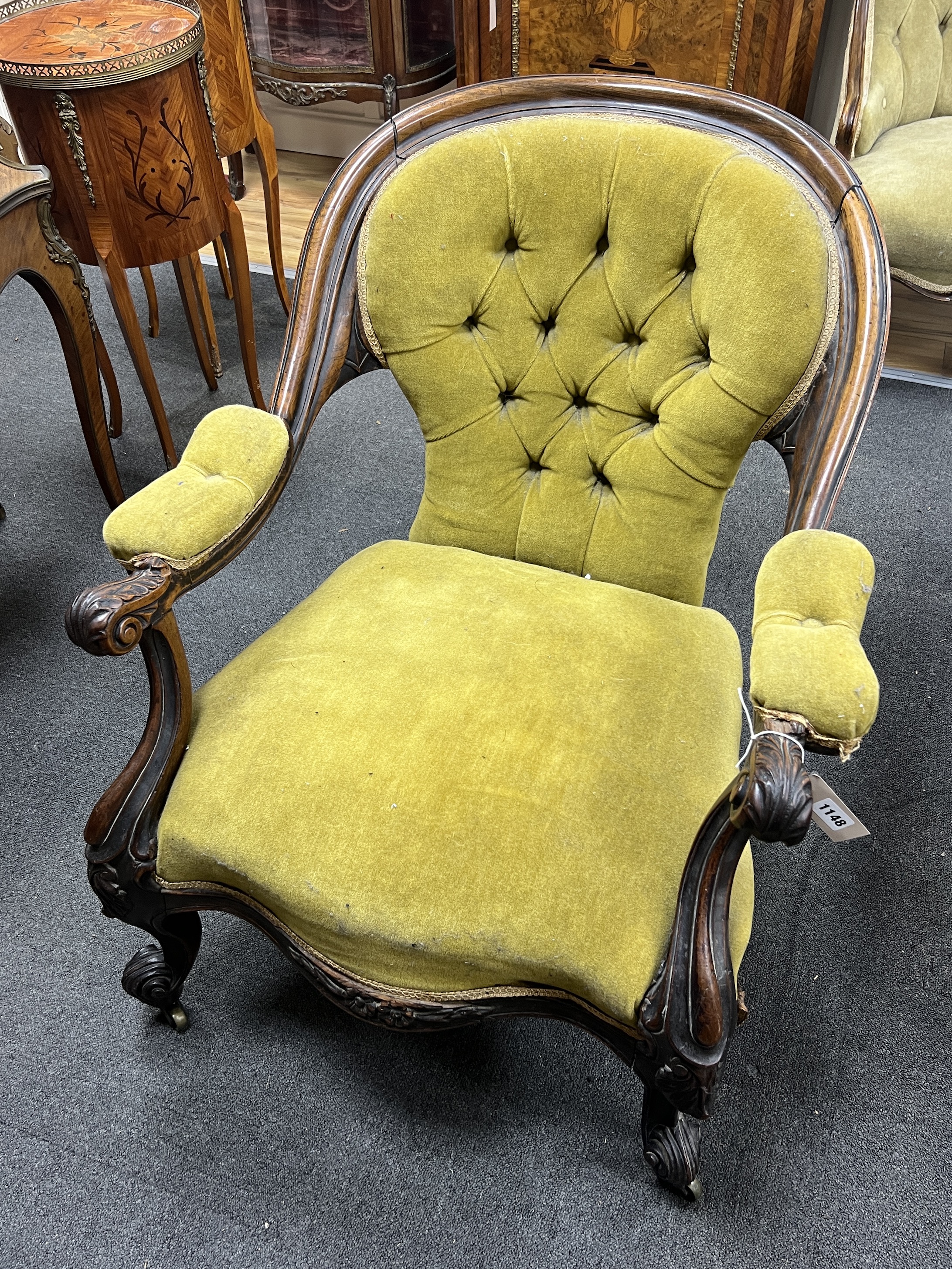 A Victorian rosewood upholstered open armchair, width 71cm, depth 72cm, height 79cm